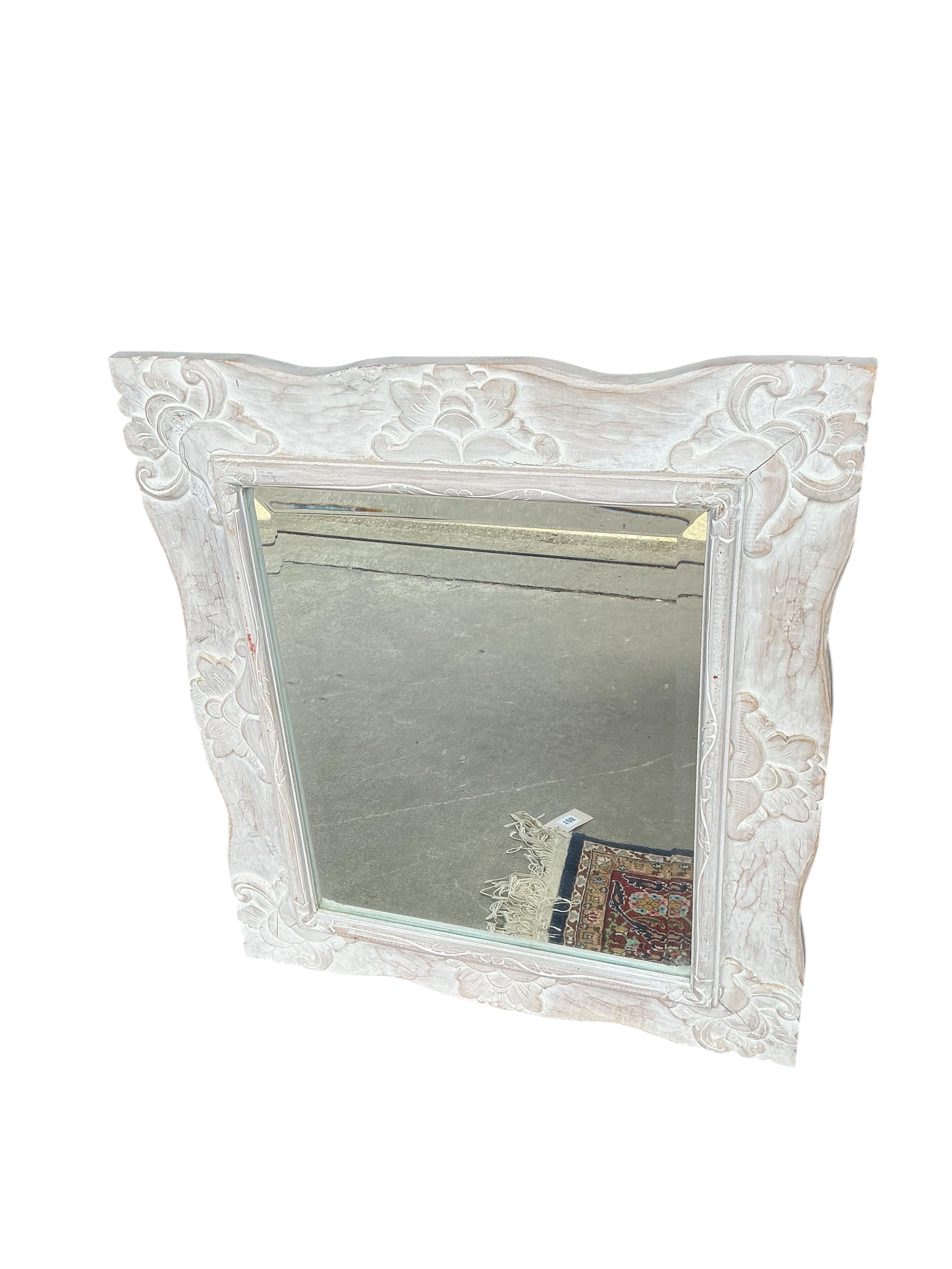 Three modern wall mirrors, of which two with hardwood frames and one carved and painted white, largest width 64cm, height 84cm